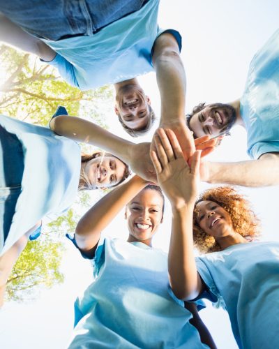 portrait-of-volunteer-group-forming-huddles.jpg